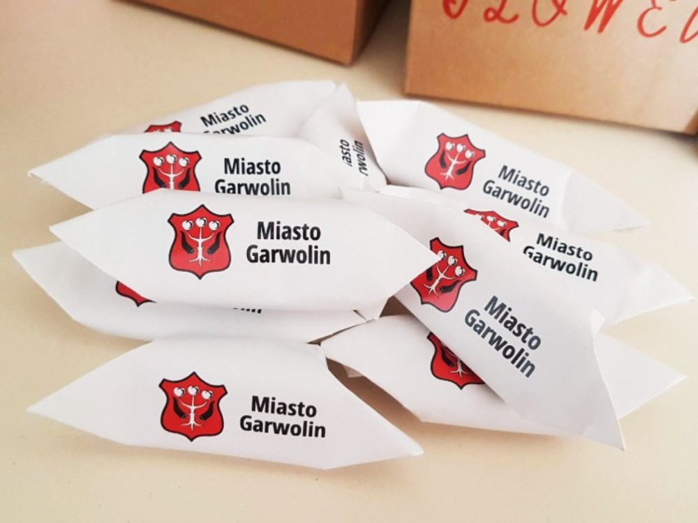 Branded fudge sweets with a company logo